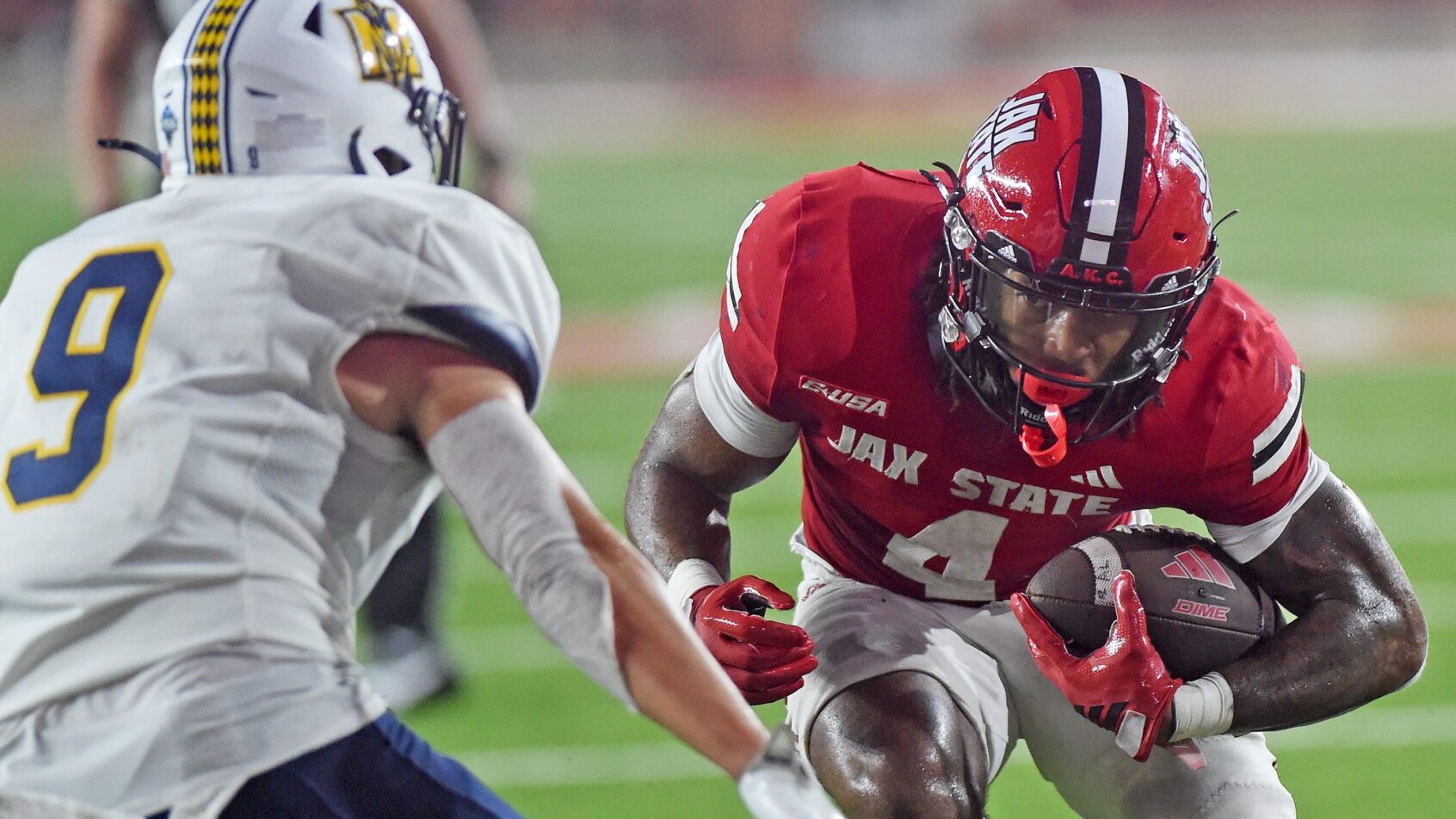 Cam Cook carries the ball versus Murray State.
