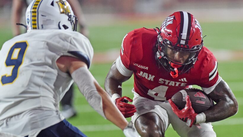 Cam Cook carries the ball versus Murray State.