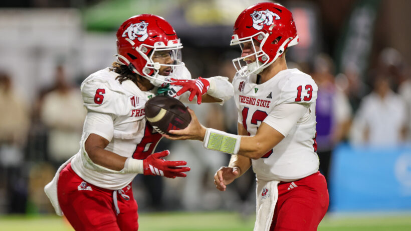 EJ Warner hands off the ball to Bryson Donelson
