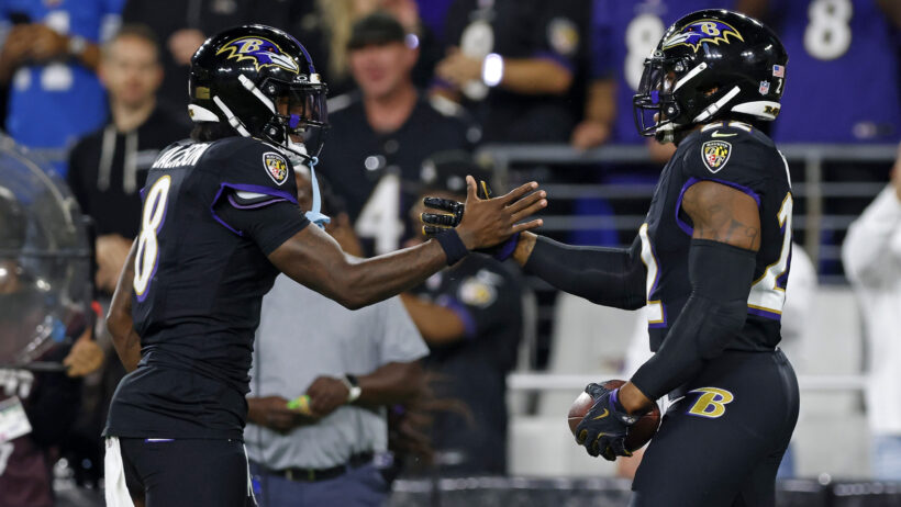 Lamar Jackson and Derrick Henry celebrate a touchdown.
