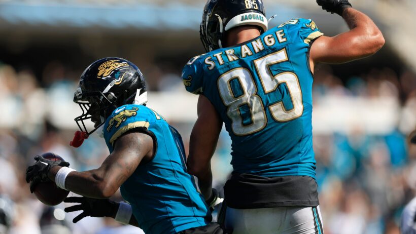 Brenton Strange and Travis Etienne celebrating after a Jaguars touchdown