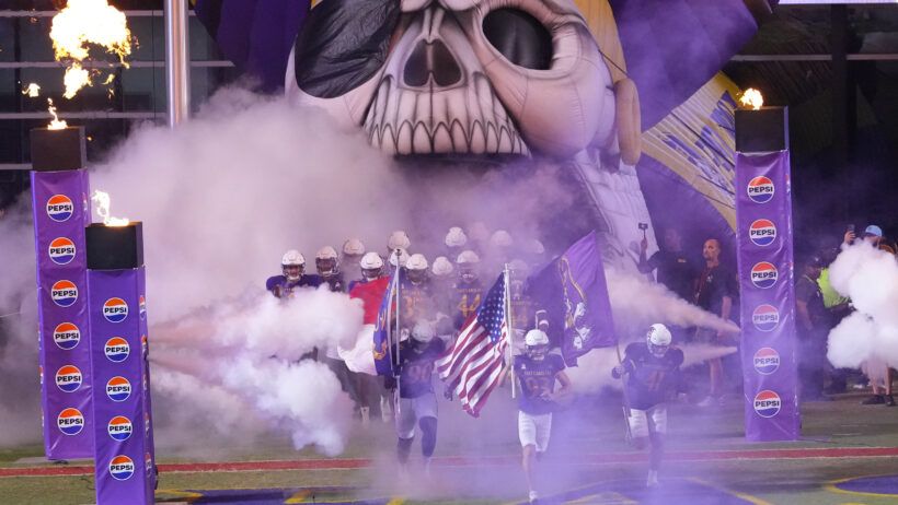 East Carolina Pirates take to the field before a game versus Army.