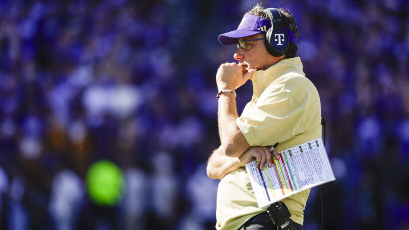 Washington Huskies head coach Jedd Fisch stands on the sideline during a timeout