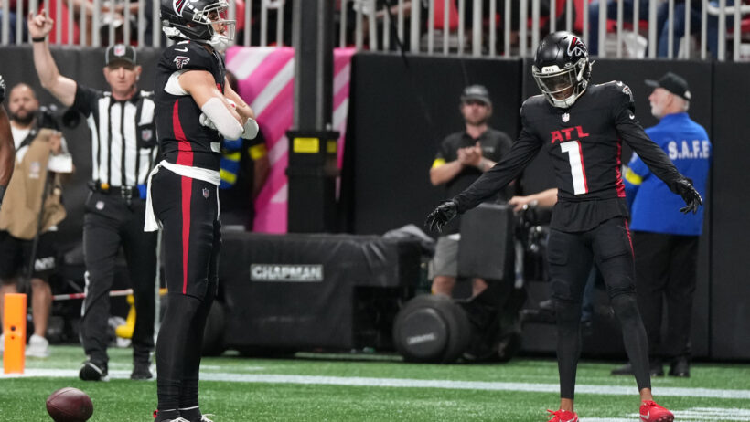 Atlanta Falcons wide receiver Drake London poses in the end zone after scoring a TD