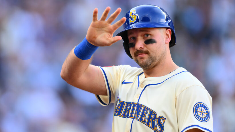 Seattle Mariners designated hitter Cal Raleigh waving to fans
