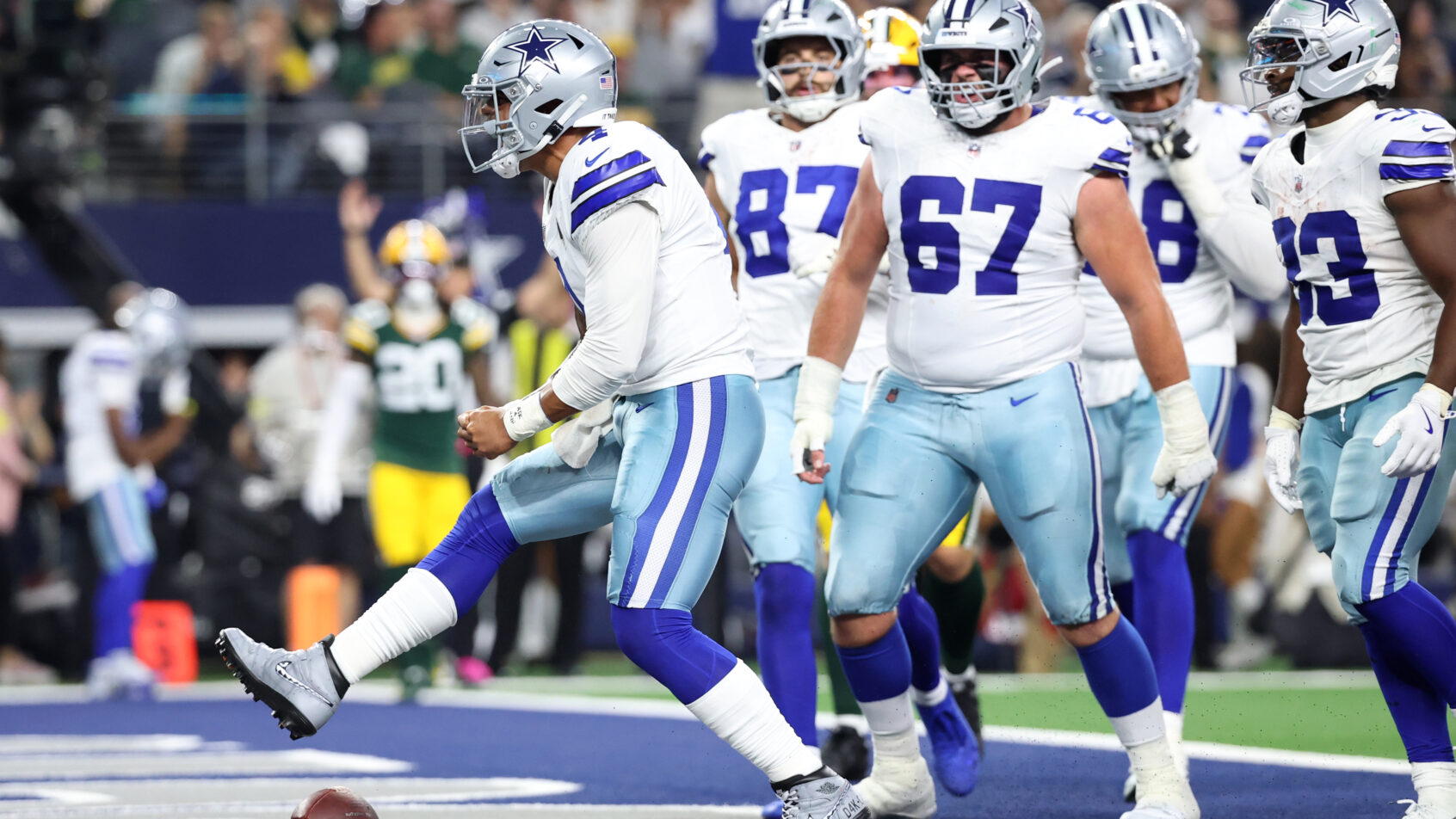Dallas Cowboys quarterback Dak Prescott celebrates a TD run