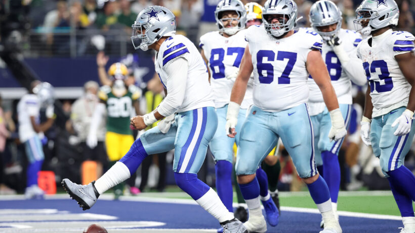 Dallas Cowboys quarterback Dak Prescott celebrates a TD run