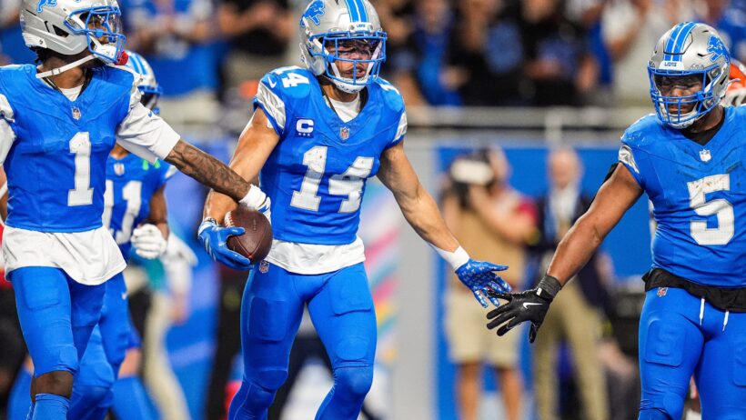 Detroit Lions wide receiver Amon-Ra St. Brown celebrates a TD with teammates