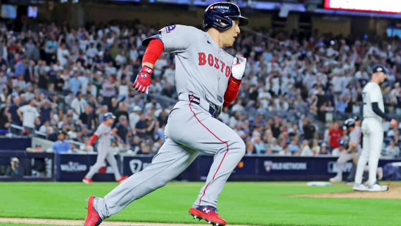 Boston Red Sox outfielder Masataka Yoshida running to first base