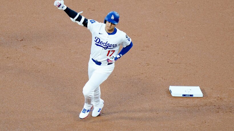 Los Angeles Dodgers designated hitter Shohei Ohtani rounds the bases after hitting a home run