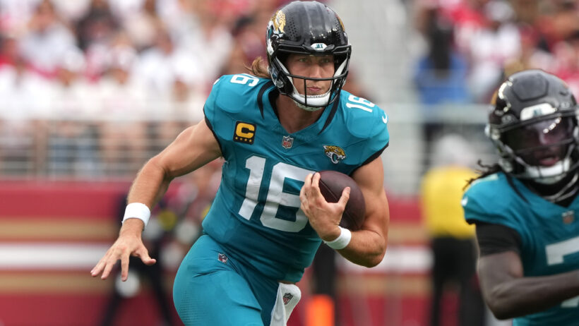 Jacksonville Jaguars quarterback Trevor Lawrence running with the ball