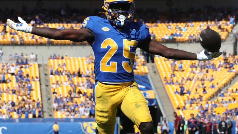 Ja'Kyrian Turner celebrating in the end zone after scoring a touchdown
