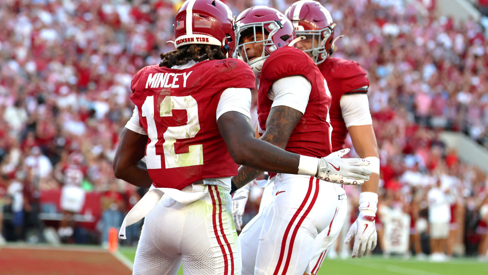 Alabama Crimson Tide defenders celebrating