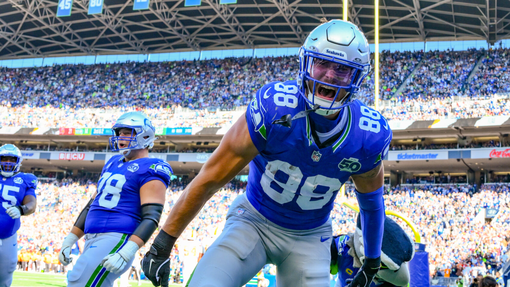 AJ Barner celebrates a touchdown versus the Buccaneers.