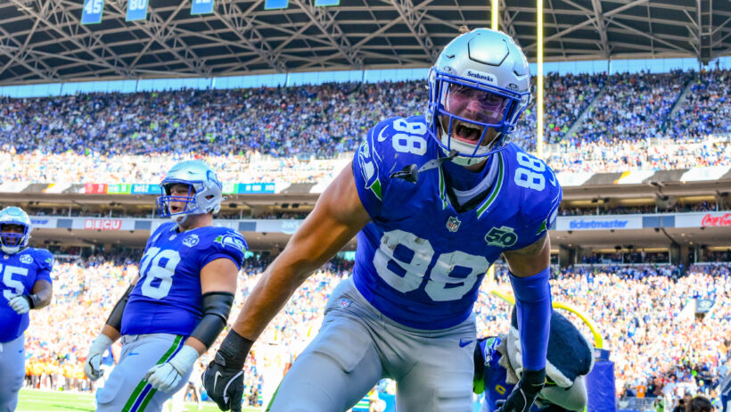 AJ Barner celebrates a touchdown versus the Buccaneers.