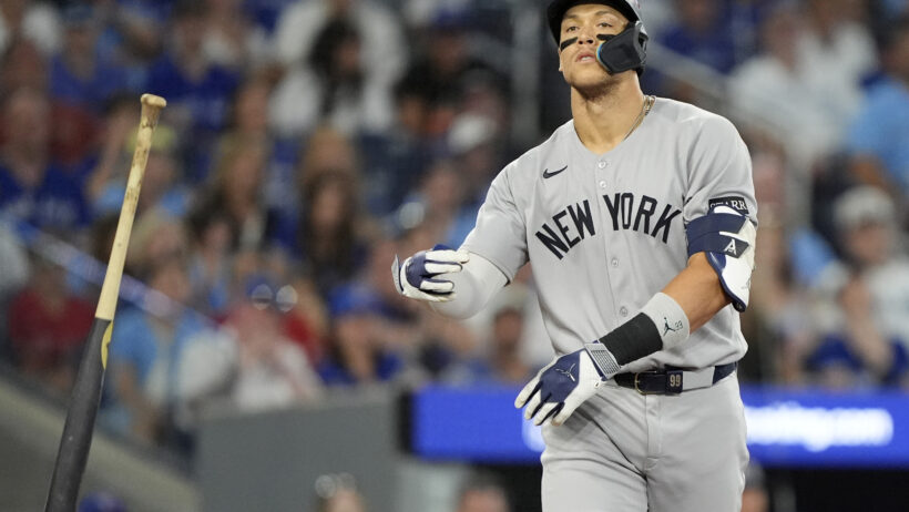 New York Yankees right fielder Aaron Judge tosses his bat after drawing a walk