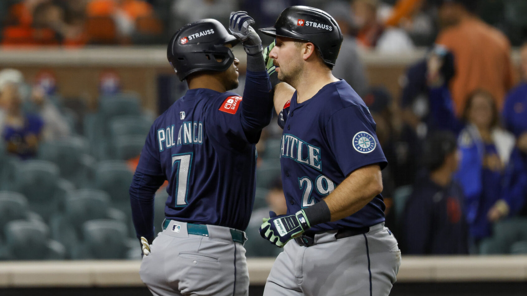 Cal Raleigh and Jorge Polanco celebrate a home run in Game 3 versus the Tigers.