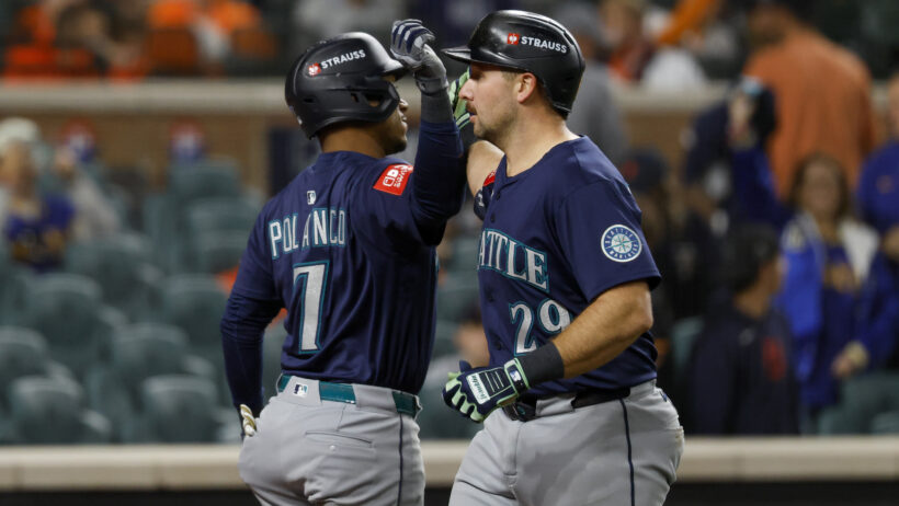 Cal Raleigh and Jorge Polanco celebrate a home run in Game 3 versus the Tigers.