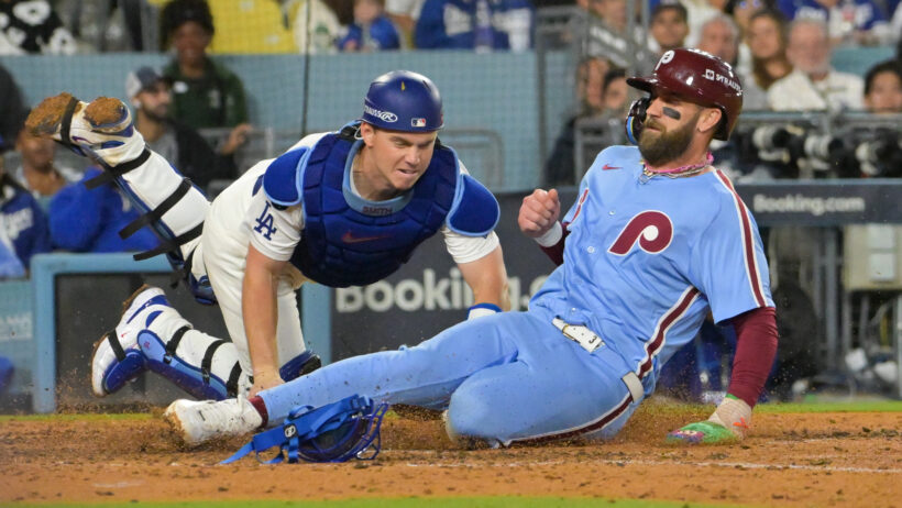 Philadelphia Phillies center fielder Brandon Marsh tagged out at home plate by Los Angeles Dodgers catcher Will Smith