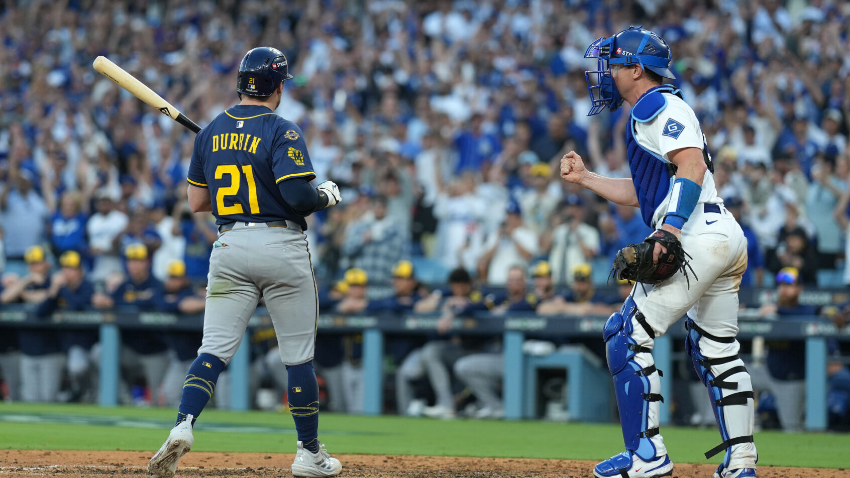 Los Angeles Dodgers catcher Will Smith fist-pumps after Milwaukee Brewers third baseman Caleb Durbin strikes out