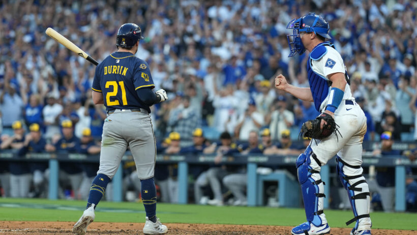Los Angeles Dodgers catcher Will Smith fist-pumps after Milwaukee Brewers third baseman Caleb Durbin strikes out