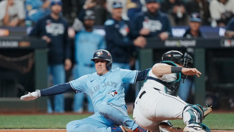 Toronto Blue Jays pinch runner Myles Straw slides into home