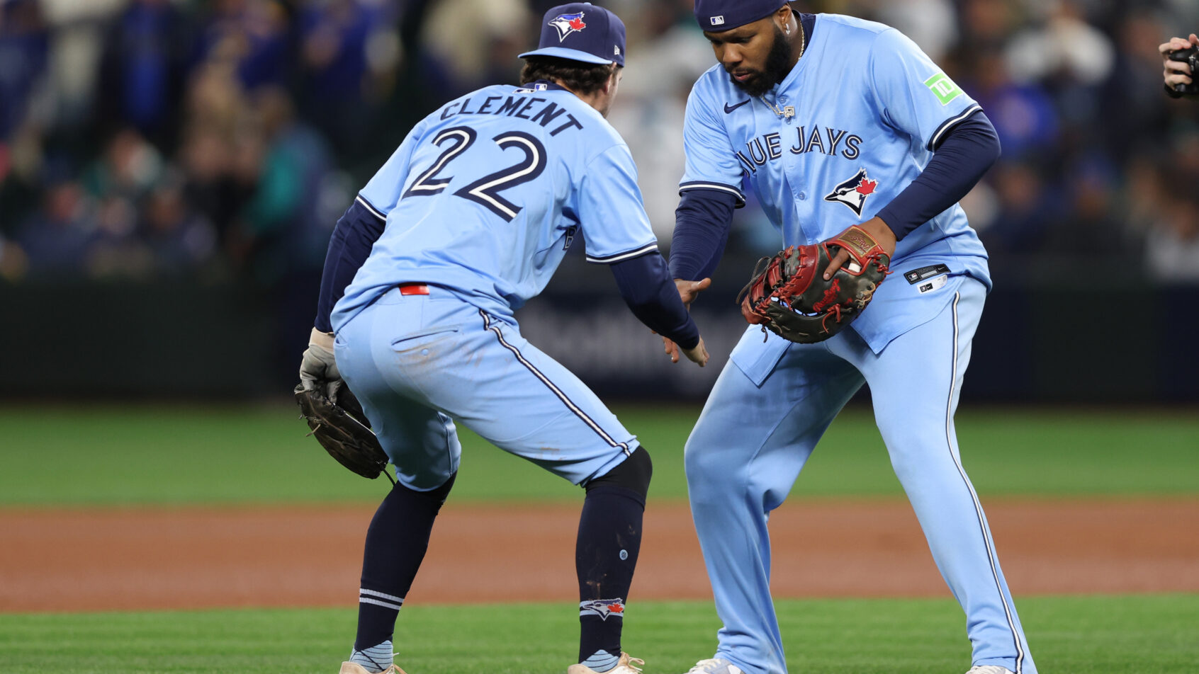 Toronto Blue Jays third baseman Ernie Clement and first baseman Vladimir Guerrero Jr celebrate a win