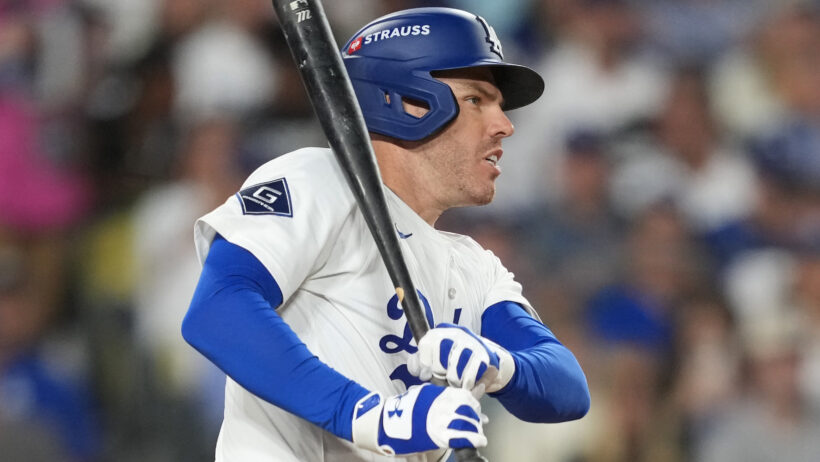 Freddie Freeman smacks a hit versus the Brewers in the NLCS.