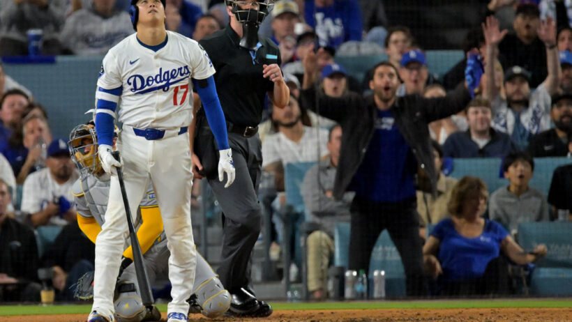 Los Angeles Dodgers two-way player Shohei Ohtani watching his home run leave the park against the