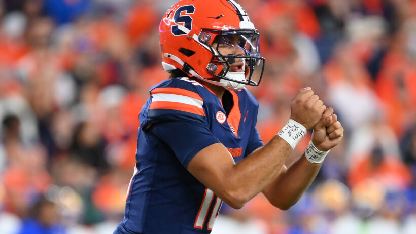 Rickie Collins signalling with his hands, making fists