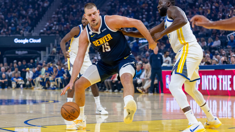 Denver Nuggets center Nikola Jokic works in the post against Golden State Warriors forward Draymond Green