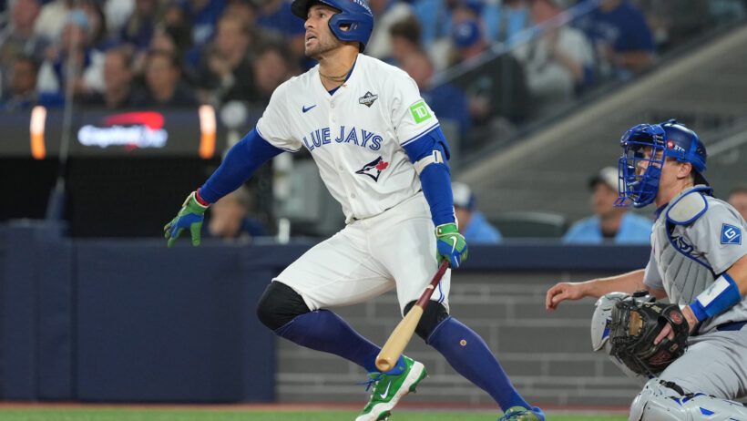 Toronto Blue Jays right fielder George Springer hitting a single