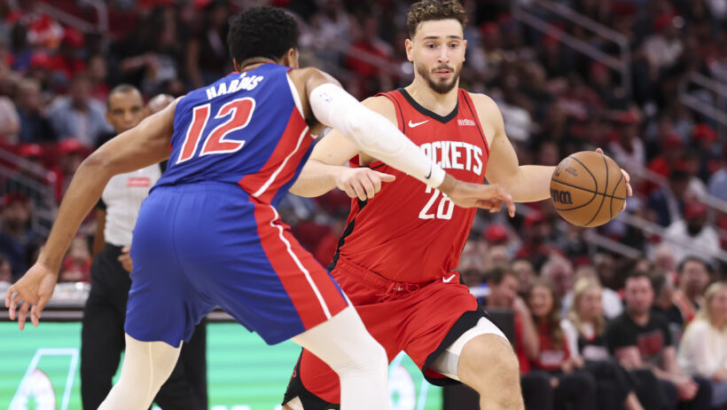 Houston Rockets center Alperen Sengun dribbling the ball