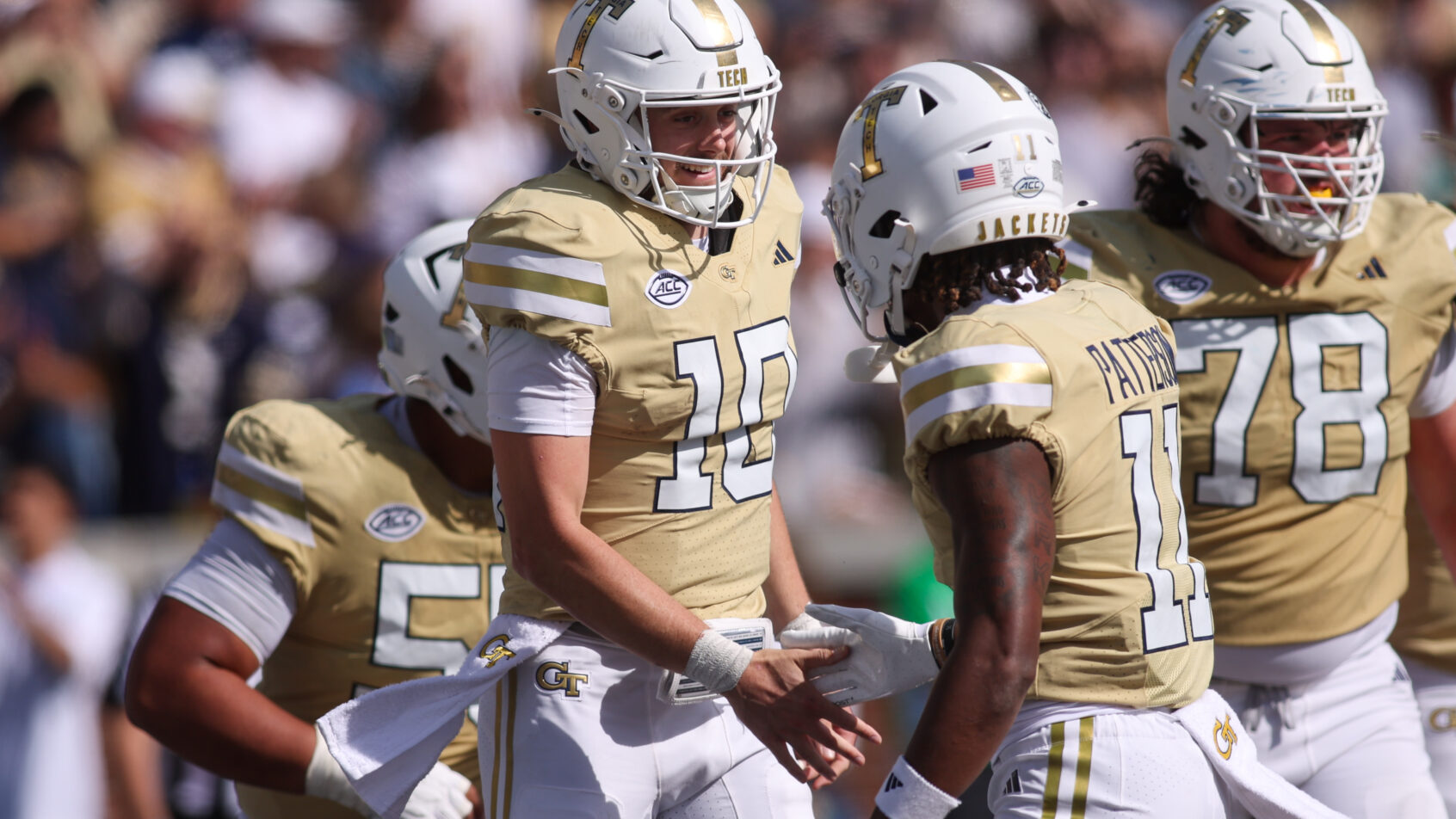 Haynes King celebrates a TD with his Georgia Tech teammates.