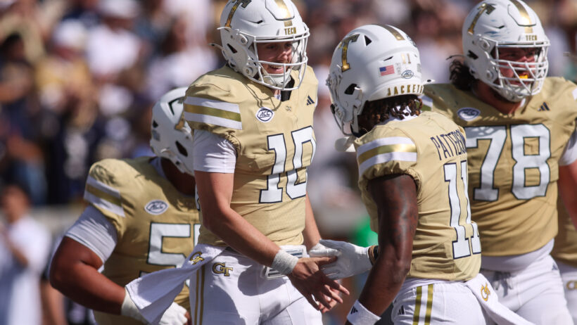 Haynes King celebrates a TD with his Georgia Tech teammates.