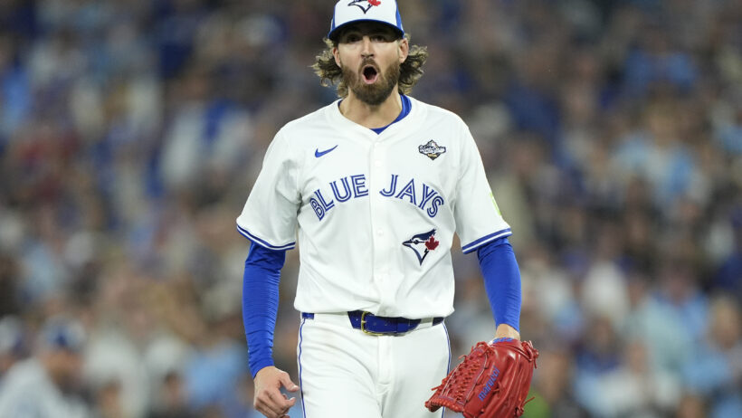 Toronto Blue Jays pitcher Kevin Gausman walks off the mound jubilantly