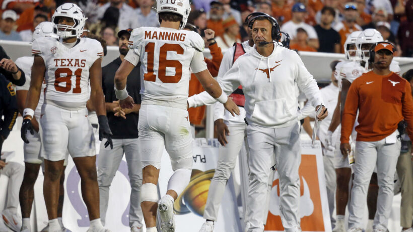 Arch Manning and Steve Sarkisian celebrate a win.