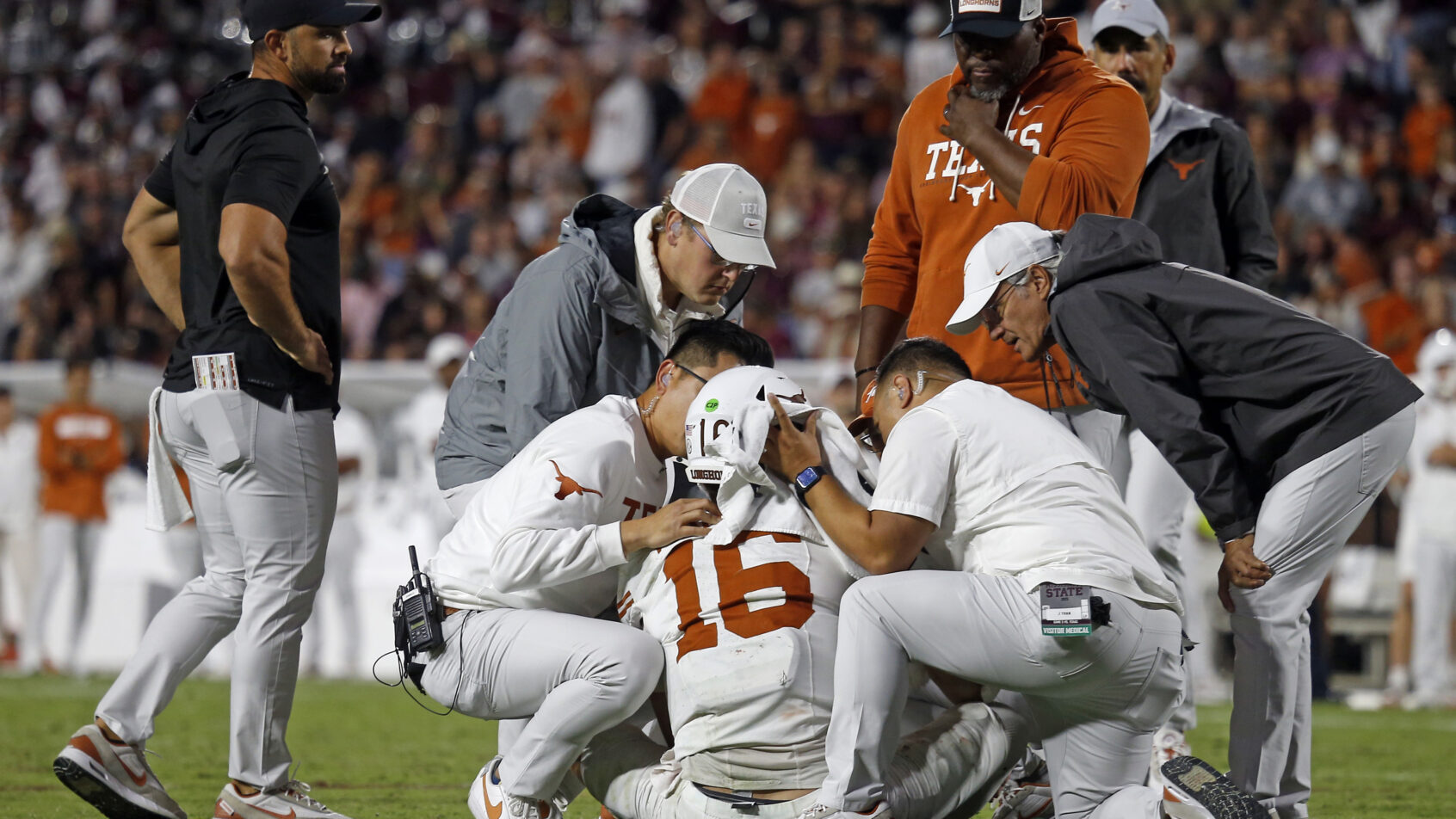 Medical staff check on Texas Longhorns quarterback Arch Manning