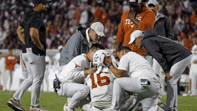 Medical staff check on Texas Longhorns quarterback Arch Manning
