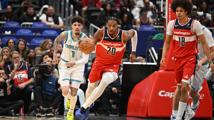 Washington Wizards center Alex Sarr dribbles up the court