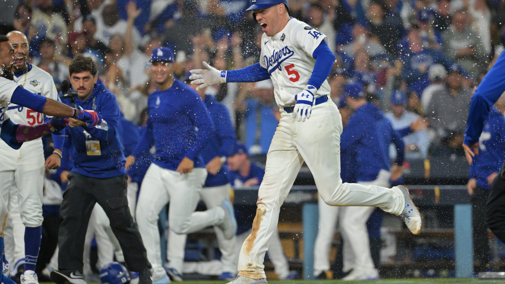 Los Angeles Dodgers first baseman Freddie Freeman crosses home plate after a walk-off home run
