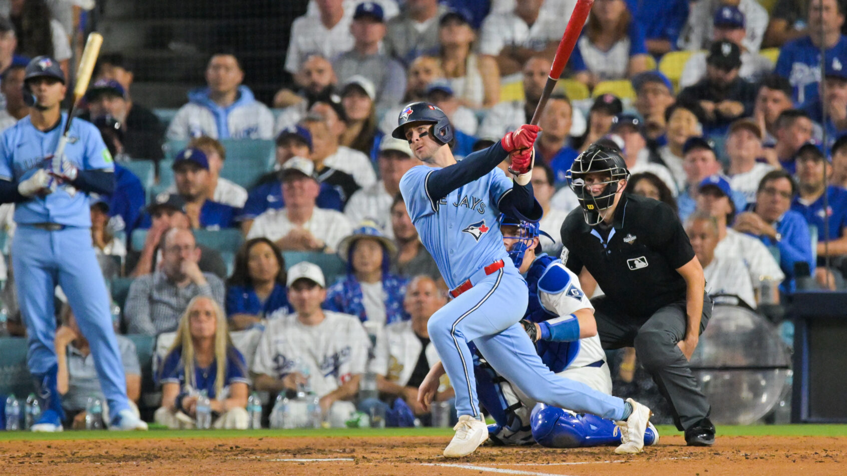 Toronto Blue Jays third baseman Ernie Clement hitting a double