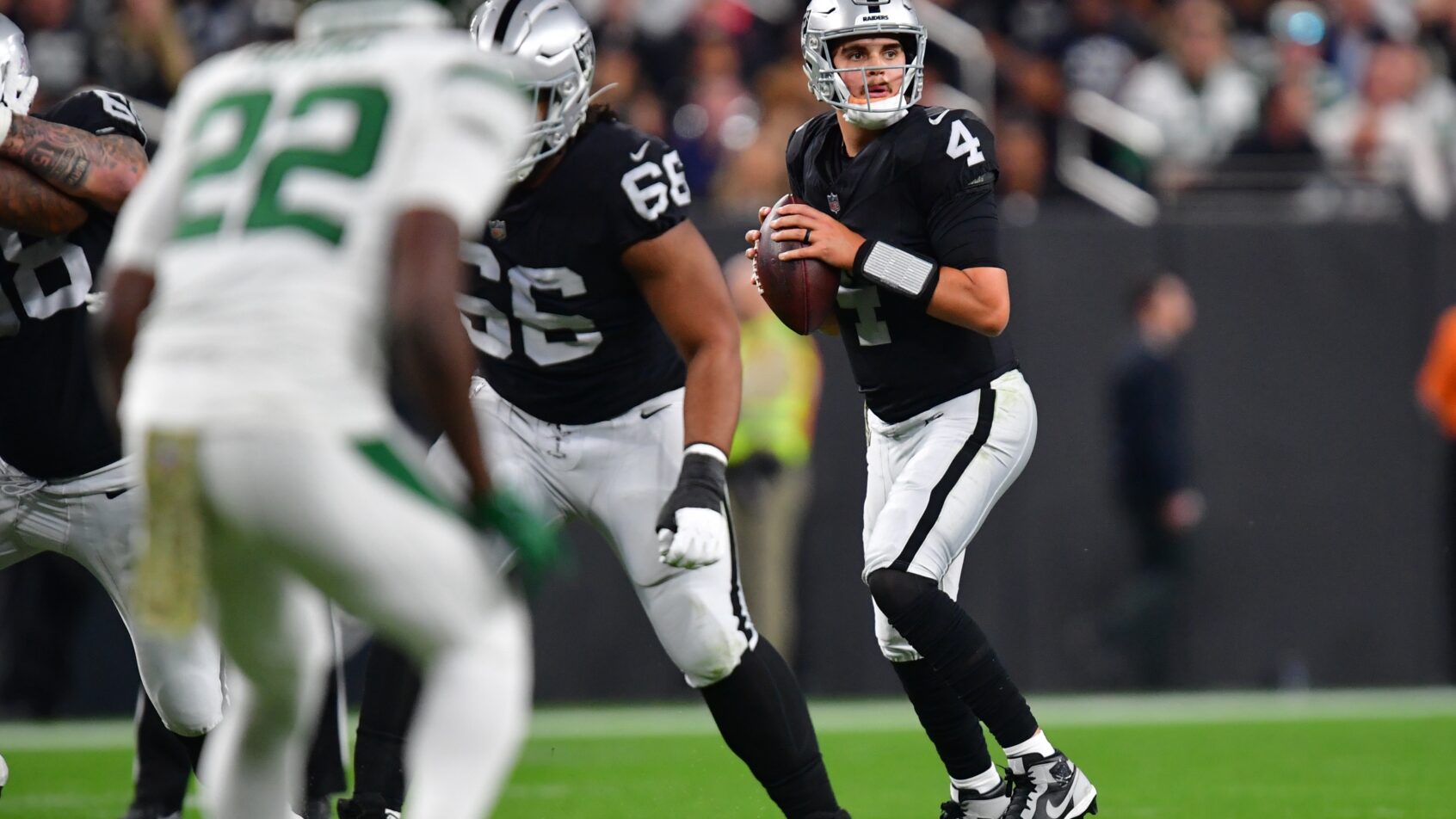 Las Vegas Raiders quarterback Aidan O’Connell looks to pass
