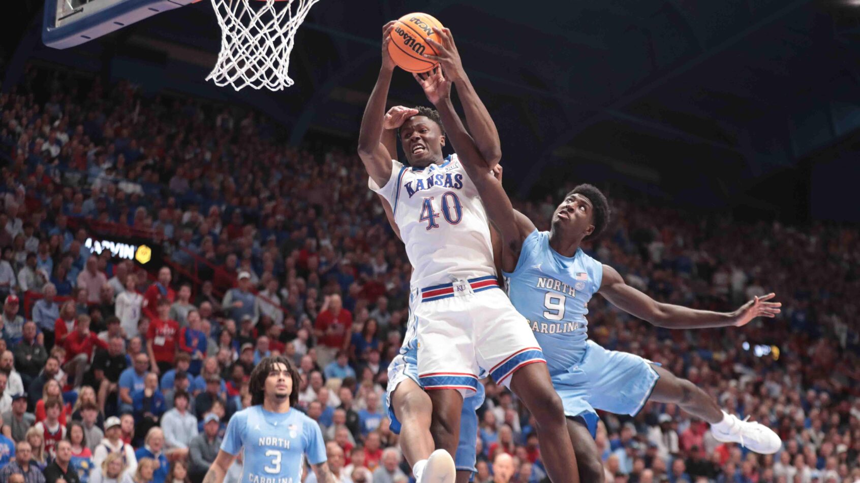 Kansas Jayhawks forward Flory Bidunga grabs a round against North Carolina
