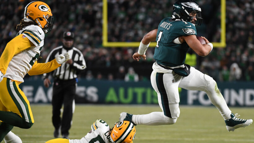 Philadelphia Eagles quarterback Jalen Hurts running with the ball against the Green Bay Packers
