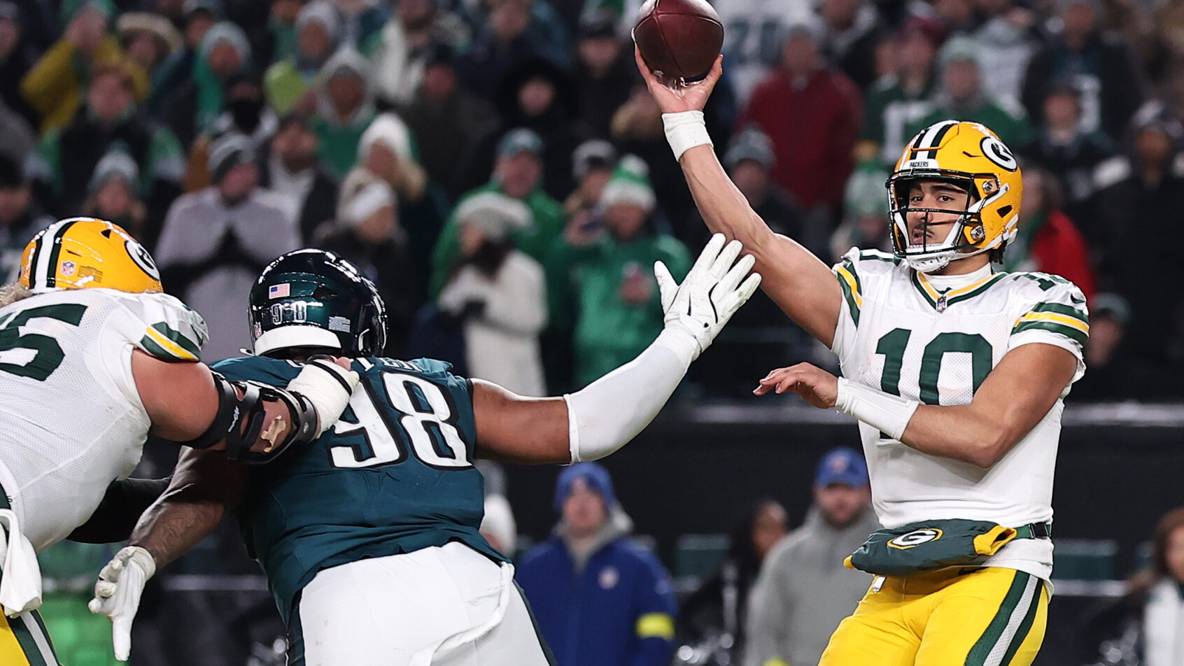 Green Bay Packers quarterback Jordan Love throws the ball as Philadelphia Eagles defensive tackle Jalen Carter rushes the passer