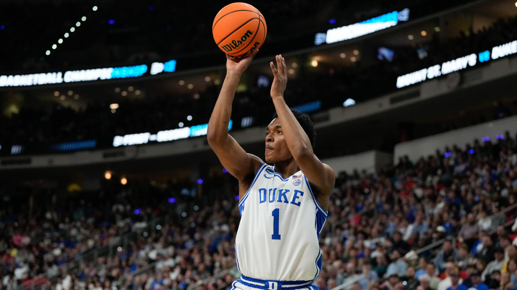 Duke Blue Devils guard Caleb Foster shooting a three