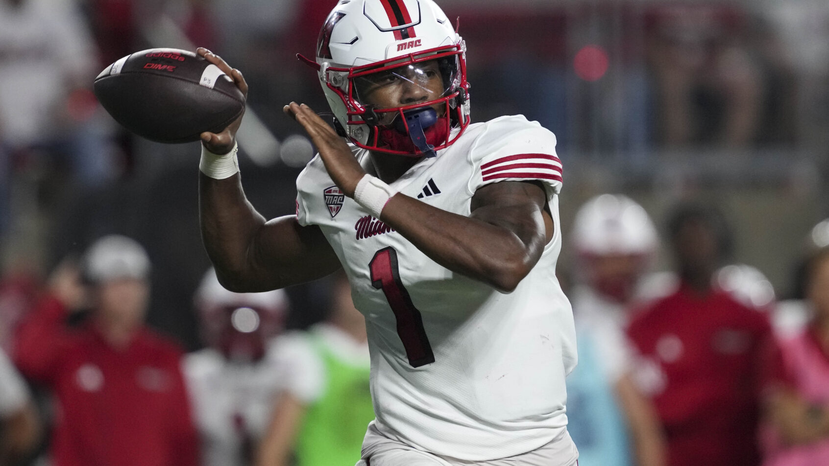 Dequan Finn throwing a pass