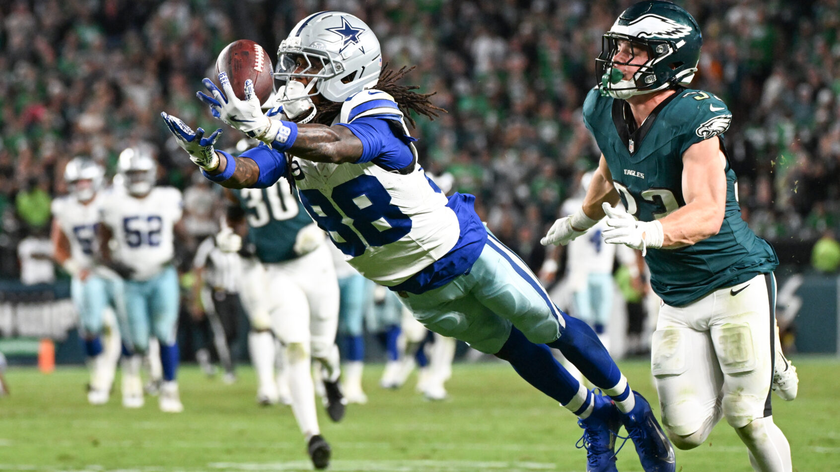 Dallas Cowboys wide receiver CeeDee Lamb tries to make a leaping catch