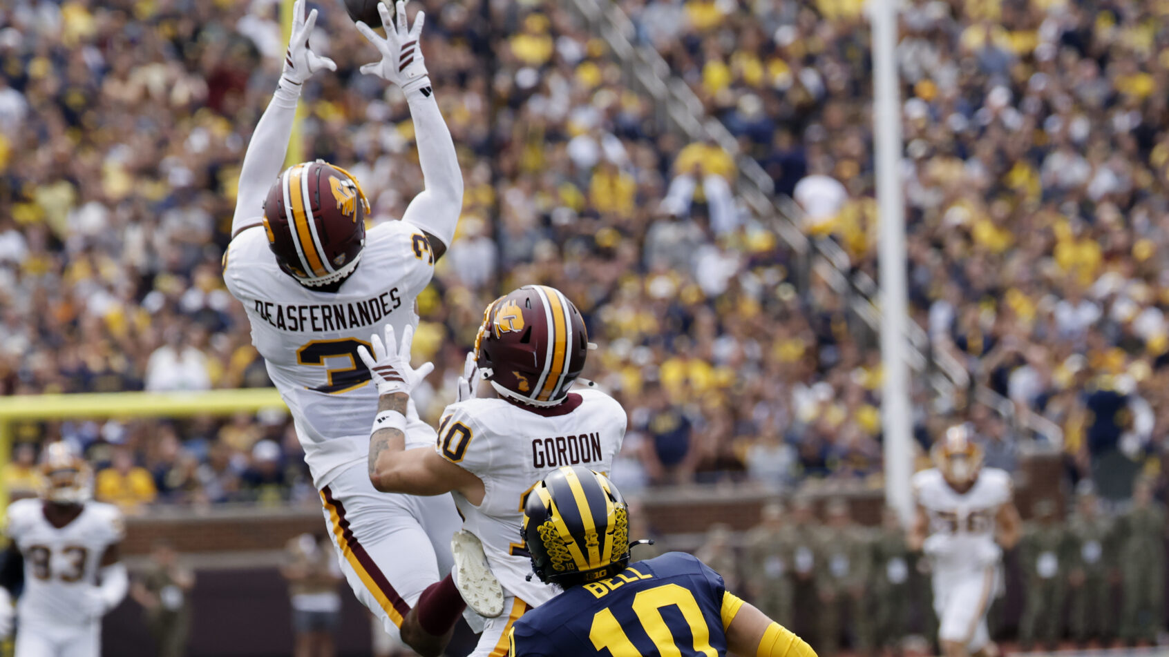 CMU intercepts a Michigan pass during a 2025 game.